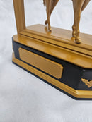 Engravable nameplate on black and gold plinth